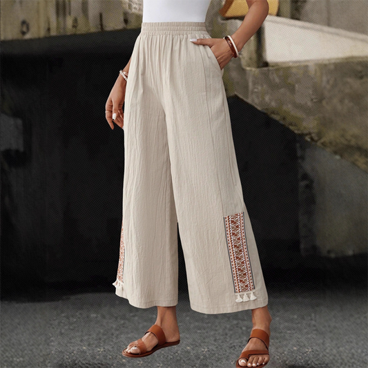 Pantalones anchos de mujer con cintura elástica y detalles de flecos