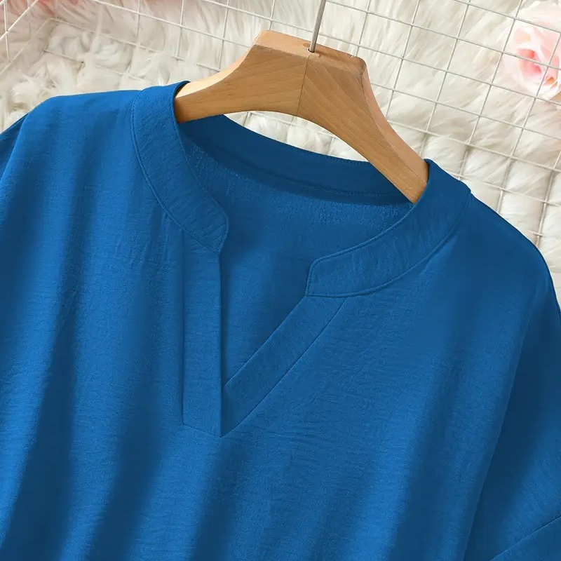 Top moderno, holgado y liso, de manga corta
